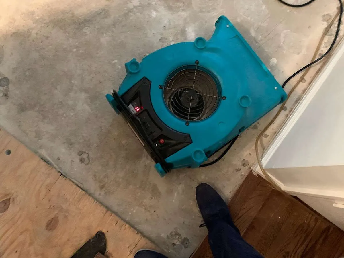 Air mover drying subfloor during Commercial Water Damage Restoration in Scottsdale